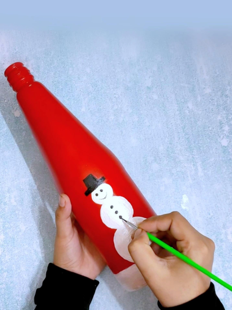Draw the button of the snowman 