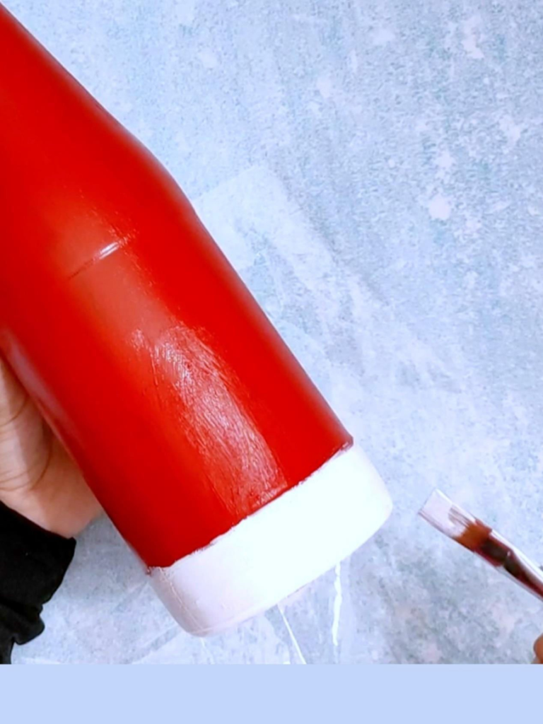 Paint recycled bottles to make Christmas decorations