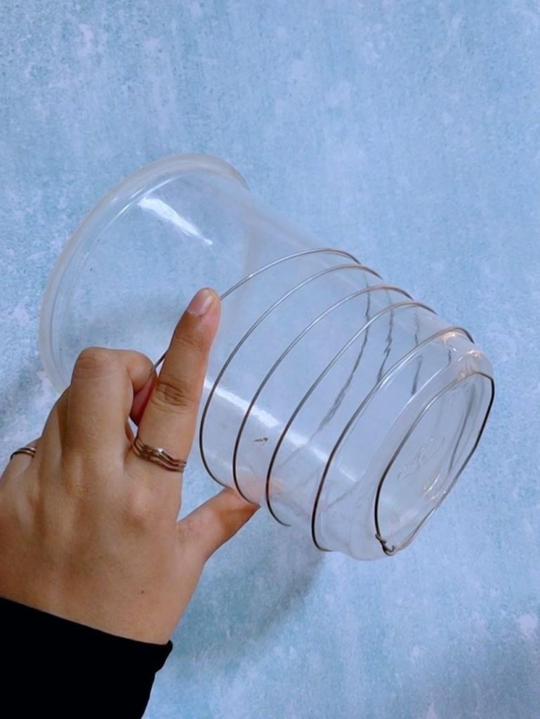 Wrap around the whole plastic cup like a spiral